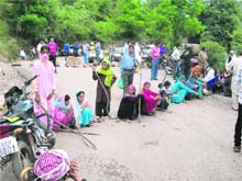 Former militant Mohammad Nisars family members protest against the police at Potha Surankote in Poonch district on Monday.