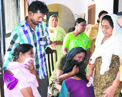 Relatives of Sandeep Peter grieve over his death in Ludhiana on Monday. 