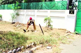 Punjab Police personnel engaged in a menial job of cleaning the entrance of the Patiala SSPs residence on Monday.