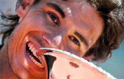 Spains Rafael Nadal celebrates with the trophy after winning the Rome Tennis Masters on Monday.