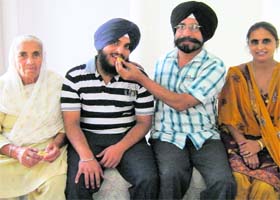 Bhavneet Singh with his family in Dera Bassi on Tuesday