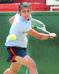 A player in action during a tennis match at the CLTA, Sector 10, in Chandigarh on Tuesday
