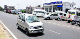Vehicles parked illegally in bylanes along the Kunjwani-Narwal highway increase the risk of accidents.
