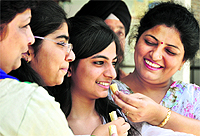 Pratibah (second from right), who got the ninth rank in the Punjab PMET shares a happy moment with her family
