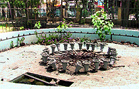 A view of the dysfunctional fountain in a park