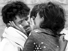 Relatives of the Hampi Express accident victims outside a mortuary in a hospital at Penukonda in Anantpur district of Andhra Pradesh on Tuesday