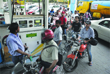 Drivers queuing to fuel up their vehicles at a petrol pump in New Delhi on Wednesday. 