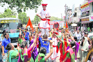 Cultural artistes from Maharashtra perform during a march by artistes from various states in Dehradun.