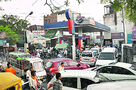 Vehicle owners make a beeline at a petrol station after a steep hike, Rs 7.50 a litre, was announced in the price of petrol on Wednesday.