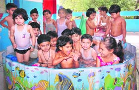 FUN IN TUB: Tiny tots of Sacred Heart Public School enjoy in a water pool in Jalandhar