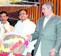 Home Minister P Chidambaram and Chief Minister Omar Abdullah try their hand at beating a drum during the inauguration of Jashn-e-Kashmir project in Kargil on Wednesday