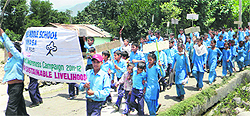 Students of various schools hold a rally to raise awareness on environment at Reasi on Wednesday