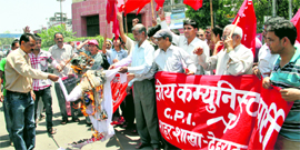 Communist Party of India workers burn an effigy of the Centre in protest against petrol price hike in Dehradun on Thursday.