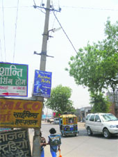 A dilapidated pole on the Rohtak Road.