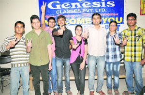 Students of Genesis Tutorial, Karnal, show victory signs after clearing the IIT entrance examination.