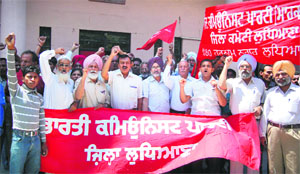 Activists of left parties protest against the hike in petrol price in Ludhiana on Thursday.