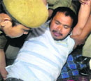 Akhil being taken to hospital by police personnel. 