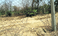 A damaged portion of the fencing in Bathinda.