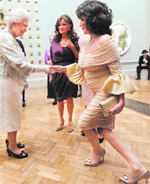 Bowing to Her Highness: British actress Joan Collins (R) with Queen Elizabeth during a function at the Royal Academy of Arts in London.  AP/PTI