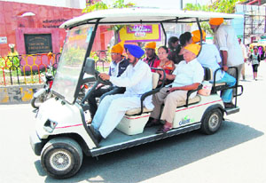 A battery-operated vehicle ferries visitors to the Golden Temple in Amritsar. 