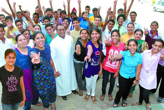 Students of the St. Xaviers High School, who scored CGPA 10 in the class X results announced late on Thursday evening, were in an exuberant mood as they met at the school in Bathinda on Friday. Also seen in the picture is the outgoing principal of the school, Father Ivo Dias. 