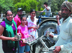 Children offering sweet water to passersby on the occasion of the martyrdom day of Sri Guru Arjan Dev Ji in Bathinda on Friday. 