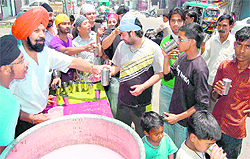 On Shaheedi Divas of Guru Arjan Dev, followers offer chhabeel to local people in Haridwar on Friday