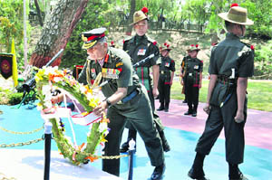 The Army Chief, General VK Singh, pays homage to martyrs by placing a wreath at the War Memorial in Dharamsala on Friday. 