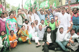 PDP activists protest against the hike in petrol price in Jammu on Friday. 
