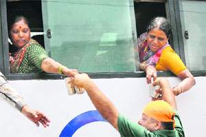 Sweetened water being served to people in Jammu on Friday. 