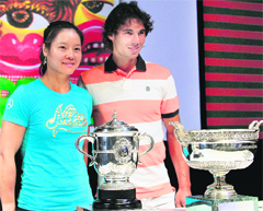 Chinese player Li Na (L) and Spanish player Rafael Nadal take part in the draw for the French Open tennis tournament at the Roland Garros stadium in Paris on Friday.  AFP