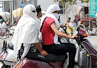 It doesn't matter how gadget savvy we are, our dependence on things traditional would continue. Moreover, many traditional things can never become obsolete like the umbrella and scarf when it comes to protecting oneself from the scorching heat. With mercury hovering well above the 40 degree Celsius mark nowadays in Bathinda, these traditional tools are still proving to be handy for beating the heat, especially for those whose work requires them to brave the sun