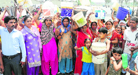 Residents of Shed Colony in Sector 52 protest against poor water supply.