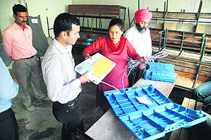 Officials prepare for the MC poll at a booth in Shimla on Saturday.
