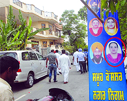 A picture of rebel SAD candidate Raminder Kaur Dhindsa (encircled), who has filed her papers from Ward 31 against the BJP candidate, used on a flex board put up outside the SAD office in Jalandhar on Saturday
