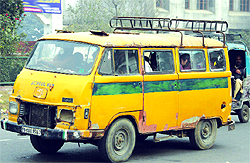 A file photo of an old school bus plying on a road in Jalandhar