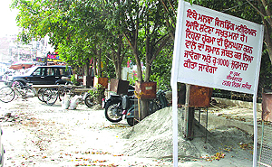 An MC board warning residents against dumping construction material outside Partap Bagh in Jalandhar