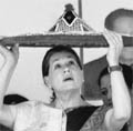 UPA chairperson Sonia Gandhi being presented a traditional Assamese Japi in Guwahati. 