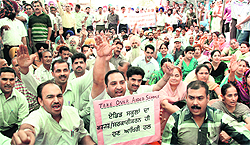 Teachers hold a protest rally in Jalandhar on Saturday