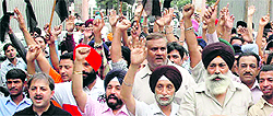 Members of the Hotel Restaurant Welfare Association at a rally in Amritsar