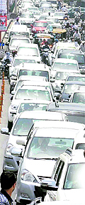 The Tribune lensman Rajesh Sachar shows a long queue of vehicles that were part of the cavalcade of a municipal corporation poll candidate who filed his nomination papers on Saturday. Such shows of might have become a routine in Patiala nowadays, leading to frequent traffic blockades on the citys streets