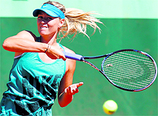 Russias Maria Sharapova takes part in a training session a day before the start of the French Open at the Roland Garros stadium in Paris on Saturday