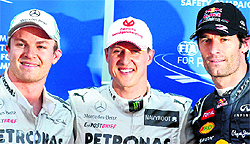 Mercedes driver Michael Schumacher of Germany (C), Red Bull driver Mark Webber of Australia (R) and Mercedes driver Nico Rosberg of Germany pose after the qualifying session at the Monaco racetrack on Saturday