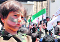 Protesters at an anti-regime demonstration at Binnish in Idlib, Syria.  AFP