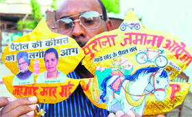 Jagmohan Singh Kanojia shows his kites to protest against the petrol price hike in Amritsar.