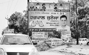 Hoardings put up by candidates contesting the Municipal Corporation elections in Patiala. 