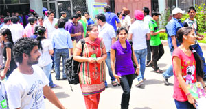 Students come out after appearing in the CET at Panjab University in Chandigarh on Sunday.
