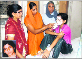 Ritu under treatment at the PGIMS, Rohtak, on Sunday; and (inset) the victim before the acid attack.