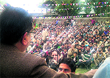 Minister for Agriculture Ghulam Hassan Mir speaks at a public rally in Pattan on Sunday