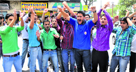 Activists of the ABVP hold a demonstration against the steep hike in the fee structures of colleges at the Main Chowk in Jammu on Sunday.